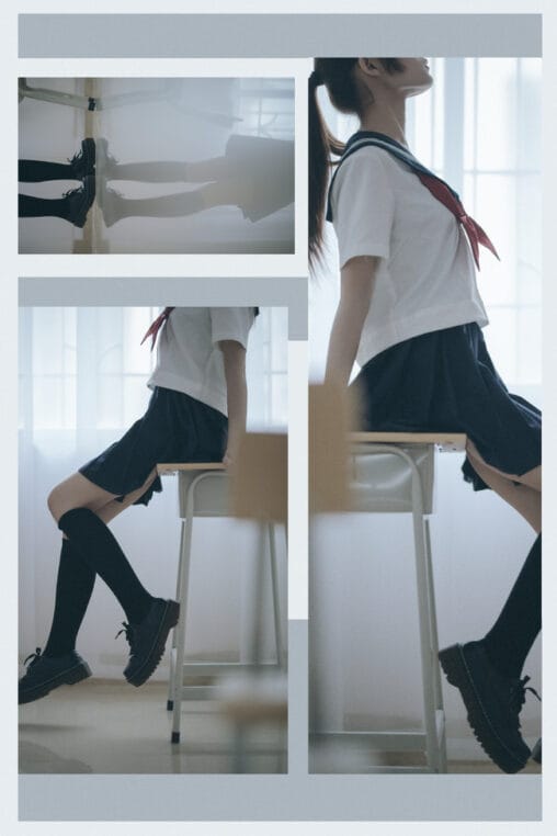Japanese sailor uniform student in a quiet classroom setting under muted ambient light