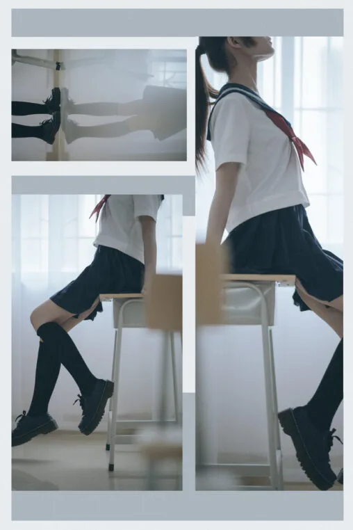 Japanese sailor uniform student in a quiet classroom setting under muted ambient light
