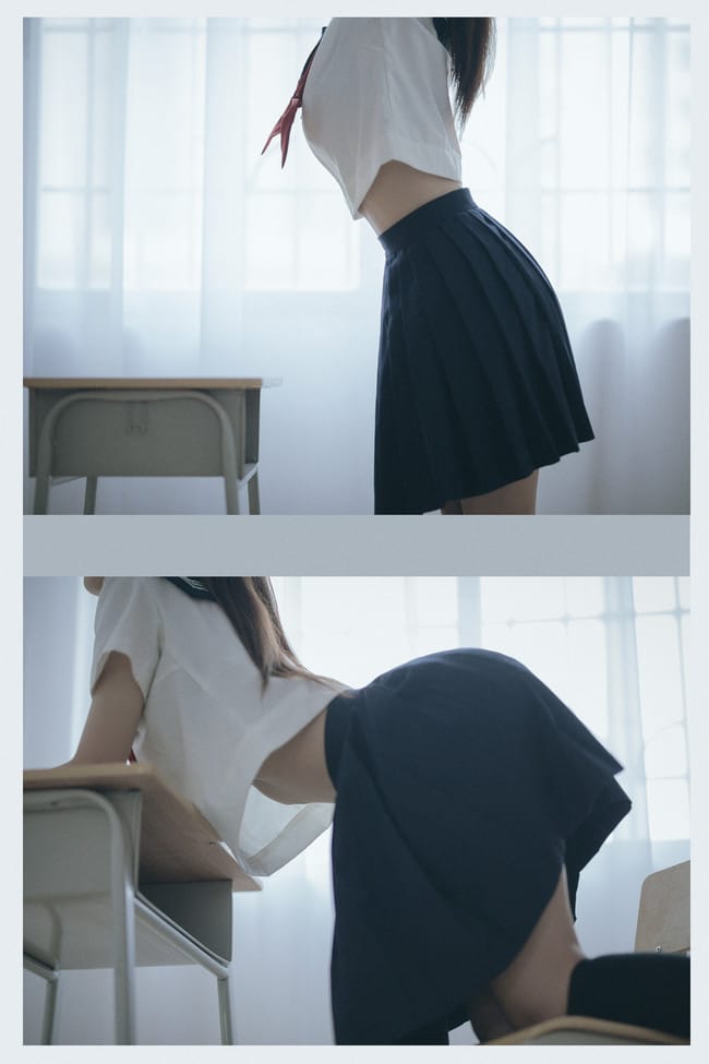 Side profile and waist-line shot of Sukii阿蛊 leaning over a school desk
