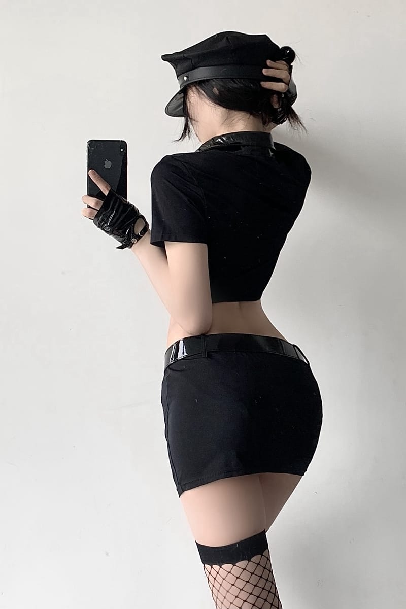 Back view of gothic police officer cosplay cropped top and mini skirt