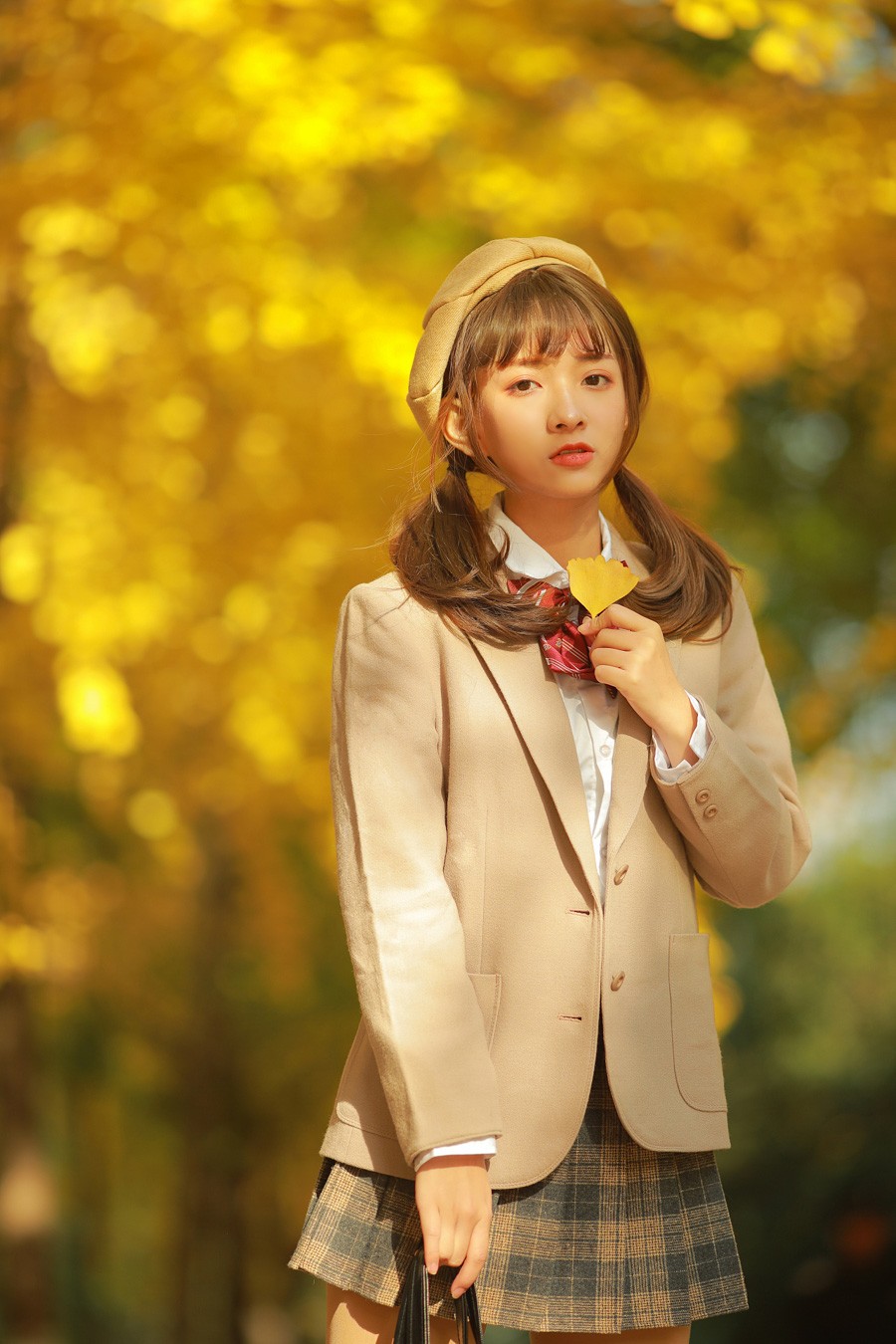 Japanese academy style girl wearing a beret holding a yellow ginkgo leaf by GWJ Wenwen